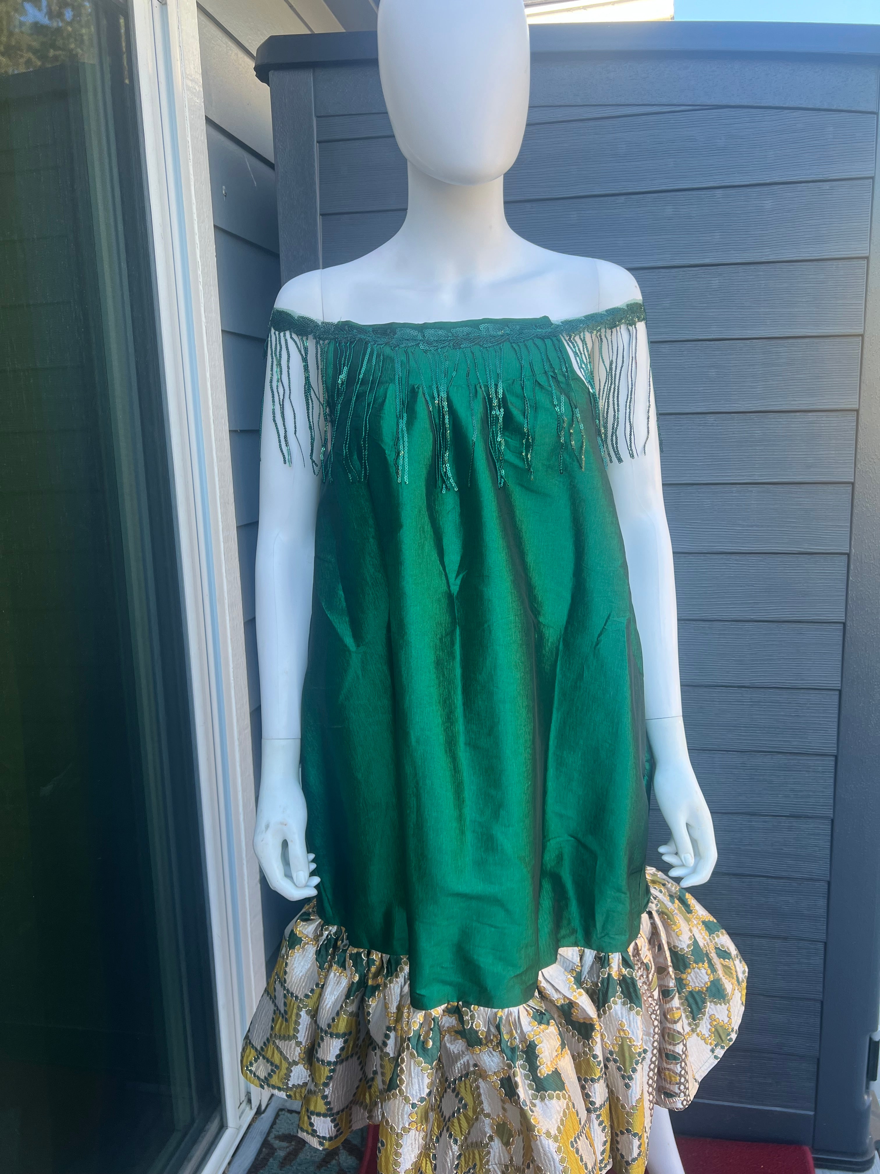 mini african kaba sewn with taffeta and jacquard. this kaba is worn by a pretty model