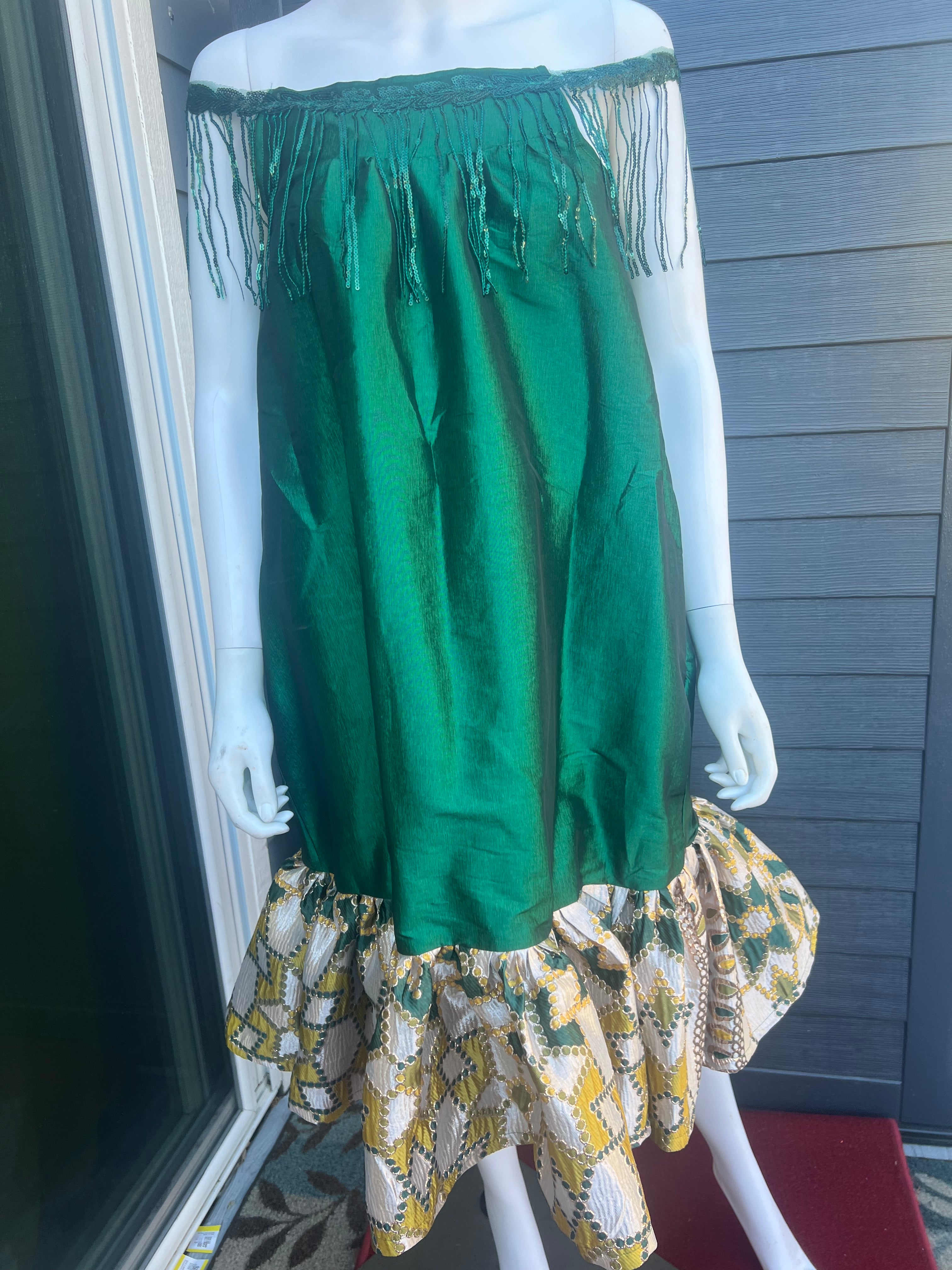 mini african kaba sewn with taffeta and jacquard. this kaba is worn by a pretty model