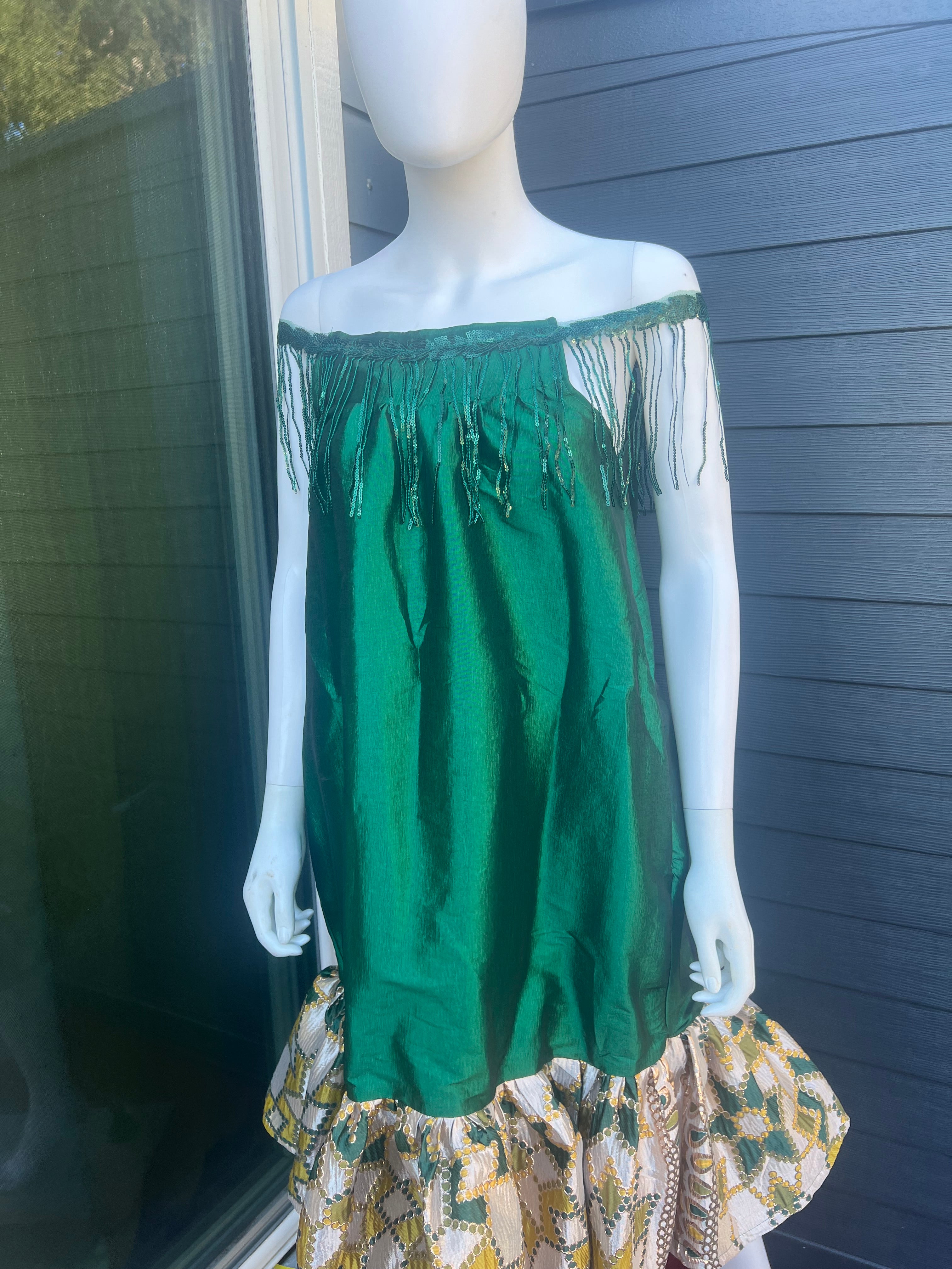 mini african kaba sewn with taffeta and jacquard. this kaba is worn by a pretty model