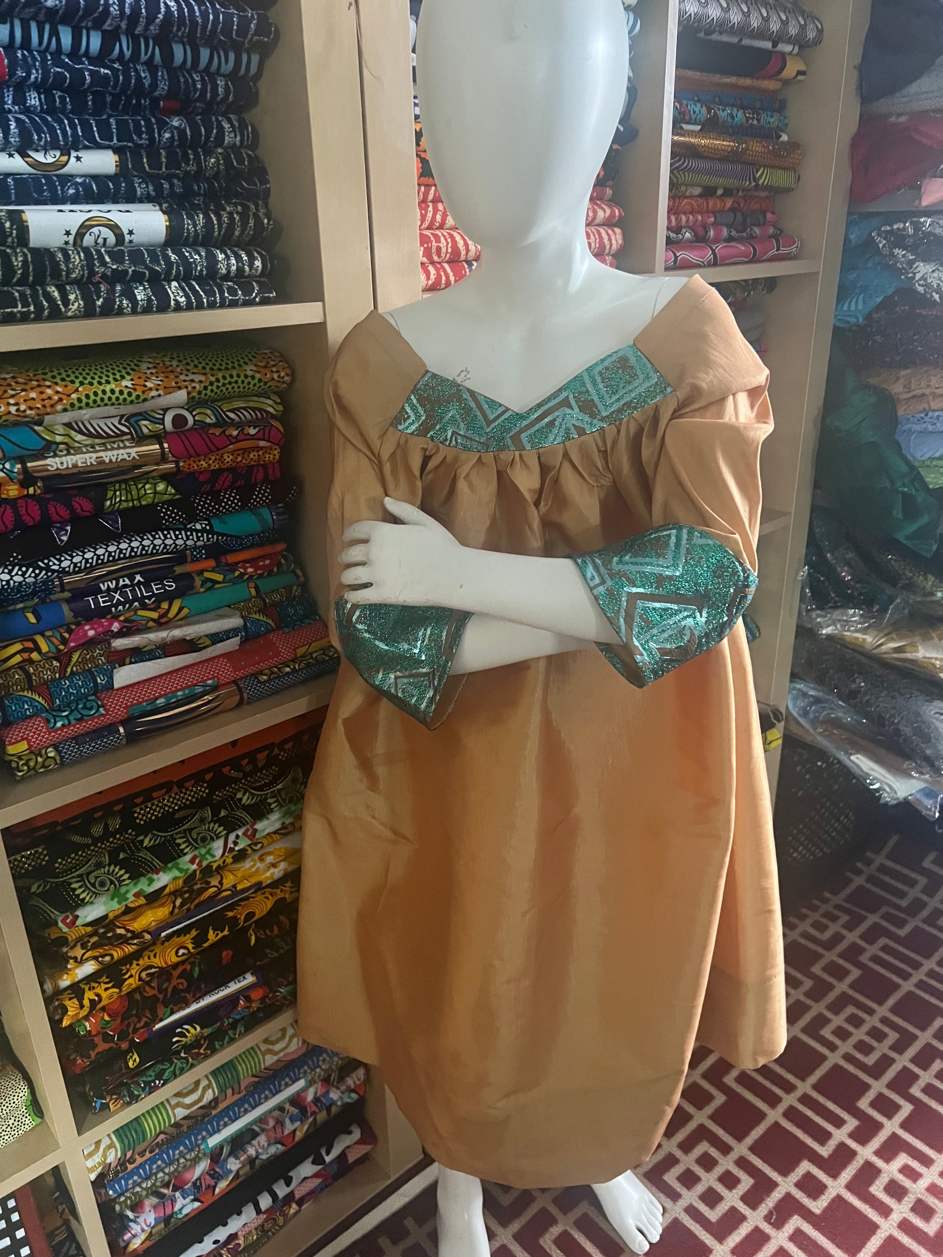 Kaba Gondo for kids African clothes sewing with a taffeta and green jacquard fabrics with a comfortable long sleeve for any walk