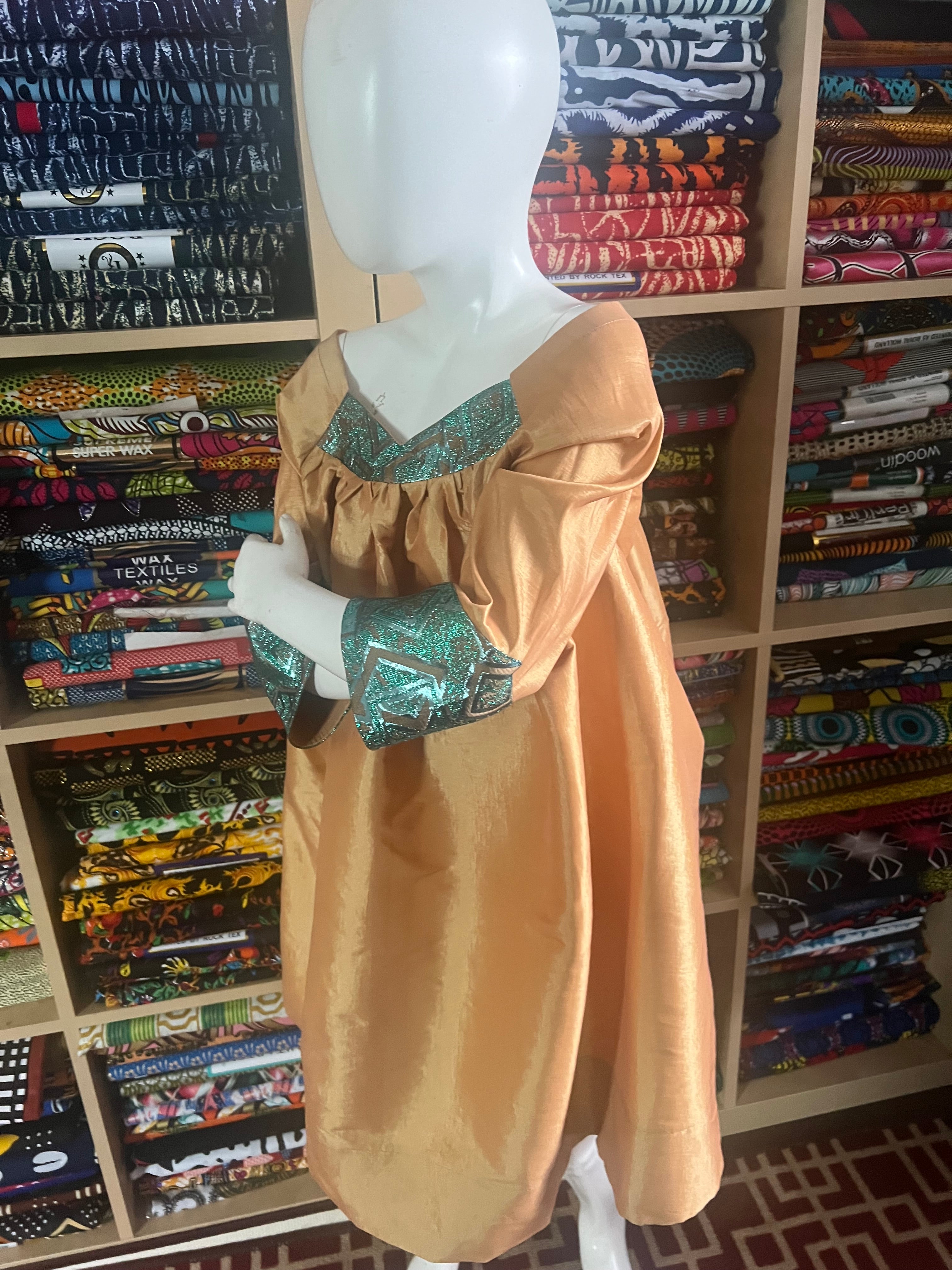 Kaba Gondo for kids African clothes sewing with a taffeta and green jacquard fabrics with a comfortable long sleeve for any walk