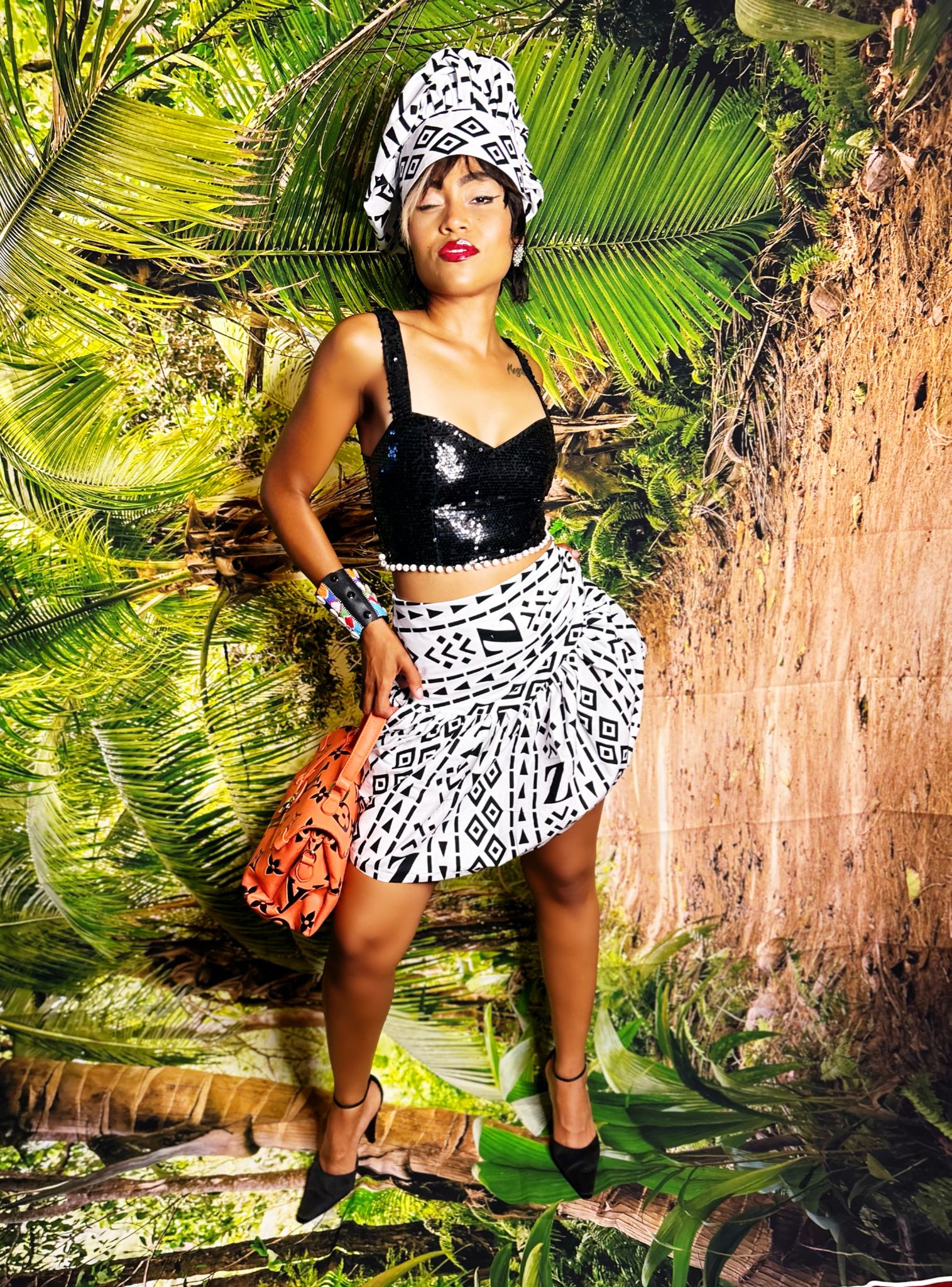 Ankara fabric. A tailored mini skirt featuring gathers at the hips for a flattering silhouette